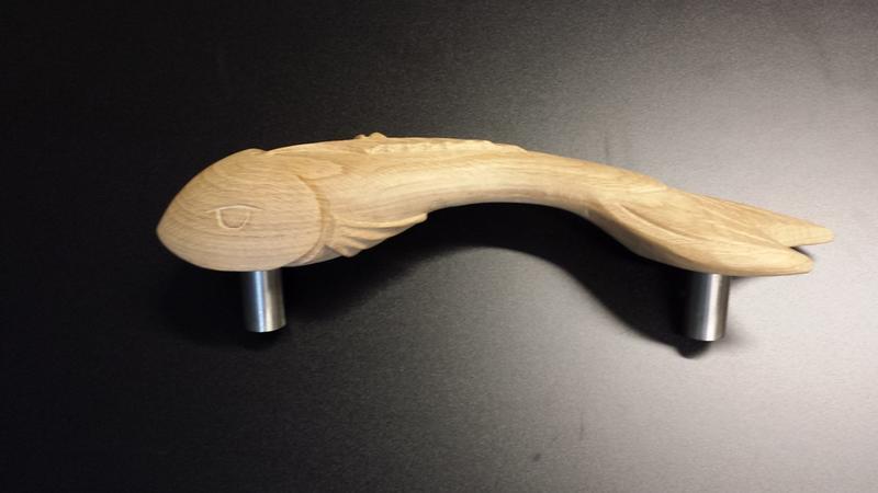Fish shape oak pull handles from Cookson Hardware Online.